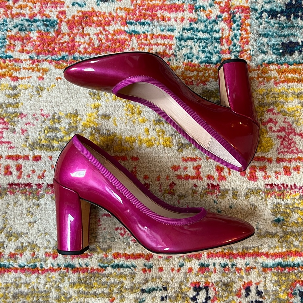 Raspberry patent leather pumps
